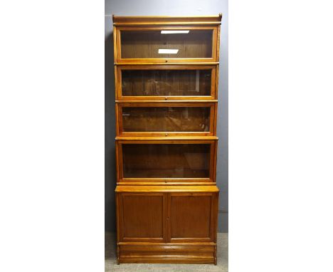 Globe Wernicke type  Barrister's teak bookcase with five glazed sections above a cupboard base, paper labels to the back and 