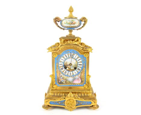 Late 19th / early 20th century French ormolu and porcelain mantle clock, painted with a romantic vignette and classical archi