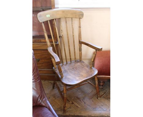 A late Victorian beech and elm stick back armchair