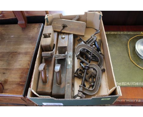 A box of assorted wood working tools including planes, garden tools etc