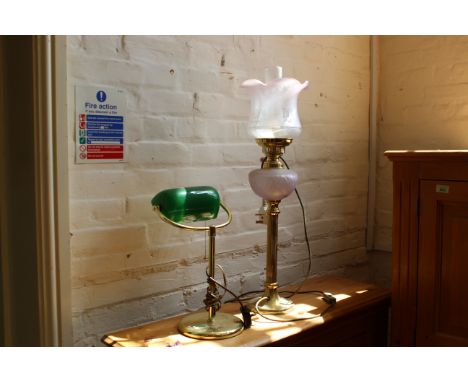 A modern brass desk lamp together with a converted oil lamp (untested)