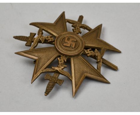 Orden und Ehrenzeichen - Spanienkreuz : Spanienkreuz in Bronze mit Schwertern.Buntmetallausführung. An breiter Nadel. Die Luf
