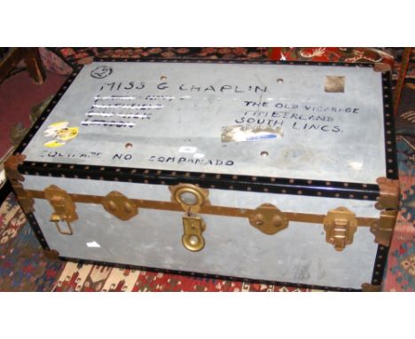 A vintage metal travelling trunk