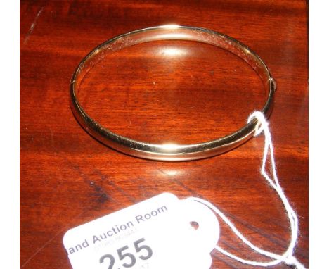 Gold bangle in presentation case