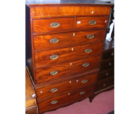 A 19th century inlaid mahogany chest on chest of two short and five long drawers on shaped bracket feet and apron
