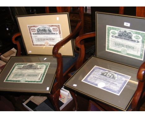 Four framed and glazed early share certificates
