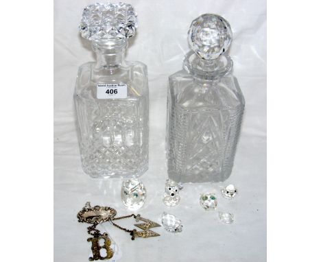 Six Swarovski animals, two cut glass decanters, together with a silver "Wine" label and two old plated ditto