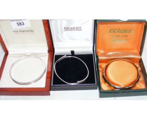 Diamond and silver bangle in presentation case, together with two others