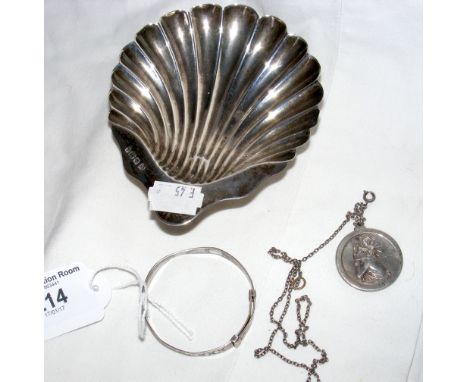A silver "Scallop" dish with Sheffield hallmark, child's silver bangle and a silver St Christopher and chain