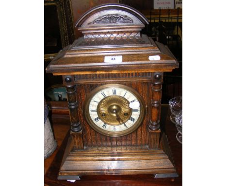 A walnut cased striking mantel clock with German movement