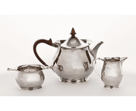 A silver three piece tea service Adie Brothers Ltd, Birmingham, teapot dated 1961, sugar bowl 1963, cream jug 1964.  Weight 7