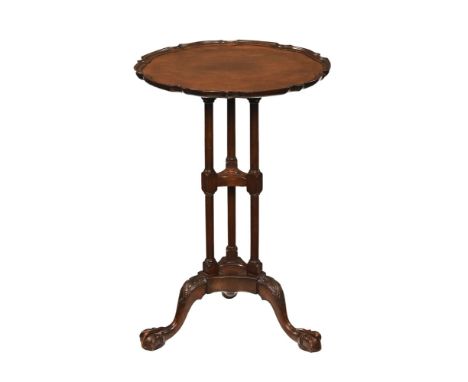 A Regency style tripod occasional table, with piecrust edge and raised on three supports with claw and ball feet.  Height 67 