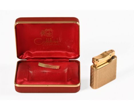 Colibri Minigas 9 ct gold stamped 375 lighter, with box.  Weight 65 grams.