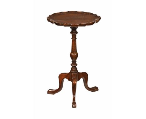 A mahogany occasional table, Chippendale style with moulded edge turned column and downswept legs terminating in pad feet.  H