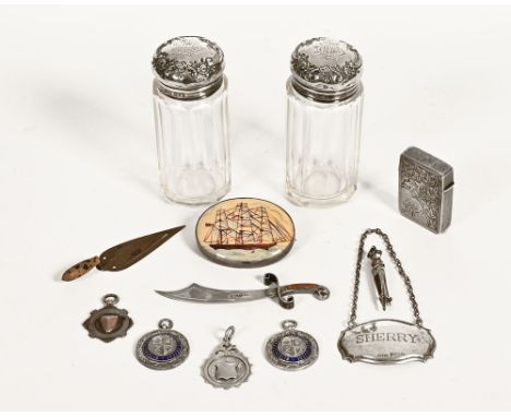 A silver sword bookmark, a small trowel, two brooches, Vesta case and pair of silver topped dressing table jars.