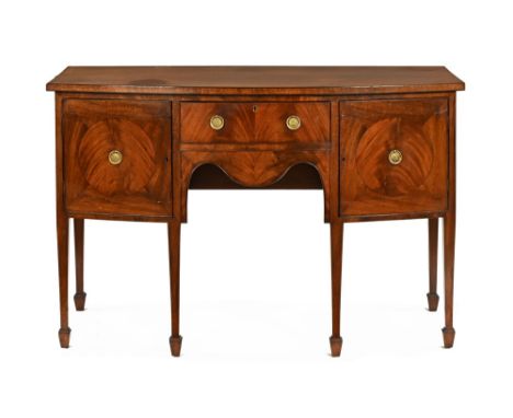 A 19th century mahogany George III style sideboard, fitted with a series of cupboards and drawer with shaped apron and raised