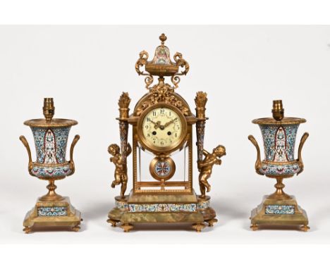 A 19th century French champleve enamel and onyx clock garniture, with two train movement striking on a bell, the movement by 