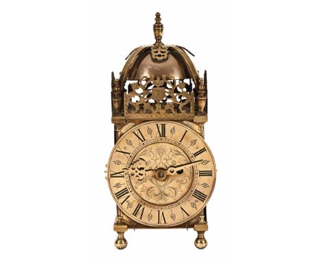 A 19th century brass lantern clock, with two train fusee movement and complete with key and pendulum.  Height 39 cm, dial dia