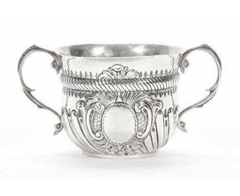 A silver hallmarked sugar bowl with rib decoration and twin handles, makers mark rubbed London date letter I 1904.  Weight 15