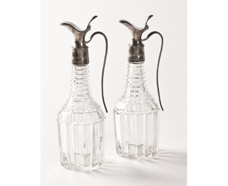 A pair of silver and glass 19th century olive oil pourers, date letter K makers mark GP.  Height 22 cm.