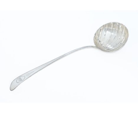 A George III silver Dublin soup ladle by John Kelly 1783, pointed end, bright cut handle round fluted bowl, four marks - Hibe