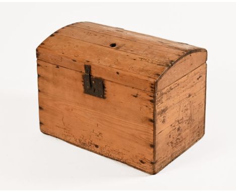 A pine dome topped trunk of small form, with working lock and key, the interior lined with paper from Reynolds Newspaper Sund