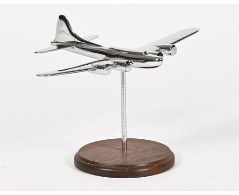 An Art Deco chrome model of a vintage aeroplane, raised on a wooden base.  Plane length 19.5 cm, wingspan 27 cm, overall heig