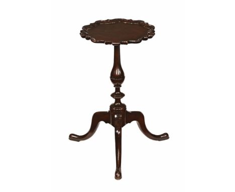 A mahogany wine table, with Chippendale style border turned column and three downswept legs terminating in pad feet.  Height 