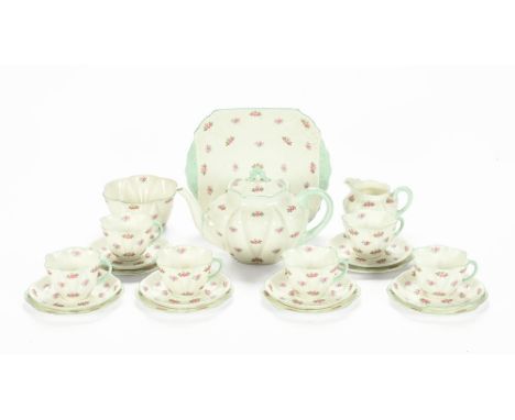 A Shelley rosebud patterned tea service, registered design no. 272101, comprising teapot, milk jug and sugar basin, 6 tea cup