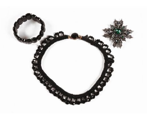 A Florenza sunburst brooch, set with a variety of coloured stones, together with a jet coloured necklace and bangle.