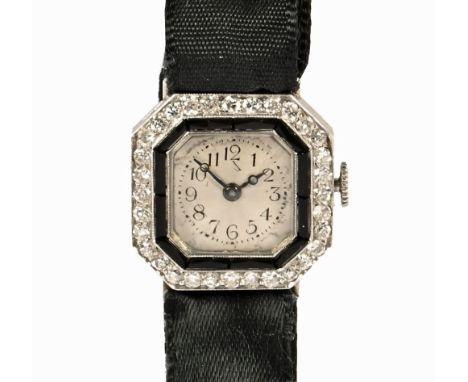 An Art Deco ladies platinum and diamond cocktail watch (see illustration).