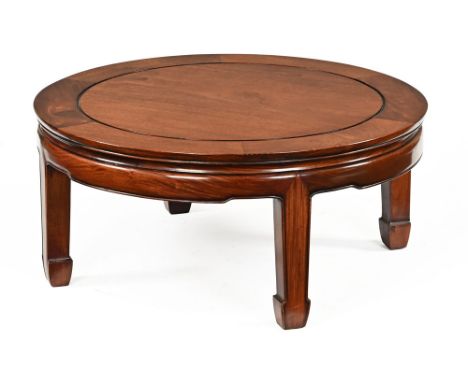 A Chinese hardwood circular coffee table, raised on four scroll legs.     CONDITION REPORT:  The table is in first class cond