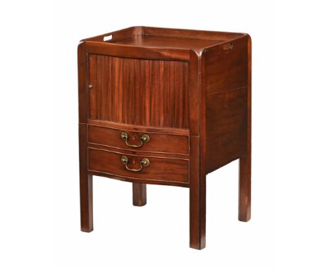 A George III mahogany serpentine fronted commode, with tambour door modelled as two and raised on chamfered legs.  Height 77 