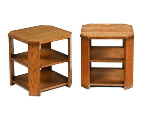 A pair of Art Deco oak side tables on stands, with canted angles and open shelves.  Height 44 cm, width and depth 43 cm.   CO