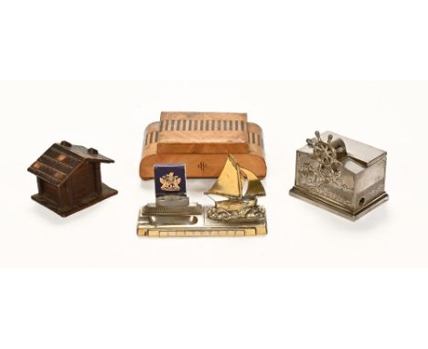 A 1920's novelty cigarette dispenser, in the form of a ships wheel, together with a similar ashtray, an Art Deco walnut cigar