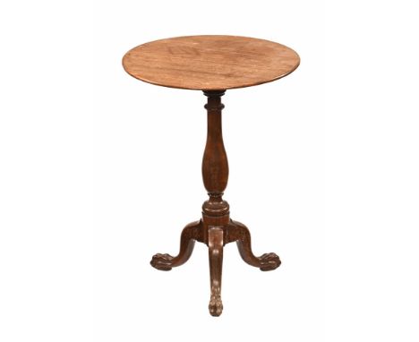 A Georgian mahogany tripod occasional table, with circular top turned base and raised on three legs with paw feet.  Height 61