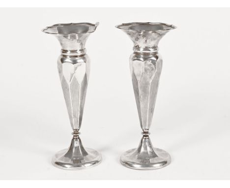 A pair of silver fluted vases, with plain engine turned finish, Birmingham hallmark 1902, maker HM, weighted bases, height 20