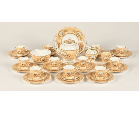 A Victorian part tea service, in gilt and beige decoration with landscaped panels (+/-39 pieces).   CONDITION REPORT:  The su