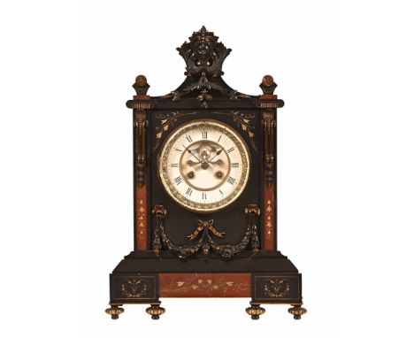 A late 19th century black slate and marble mantel clock, with two train movement striking on a bell and with visible brocot e