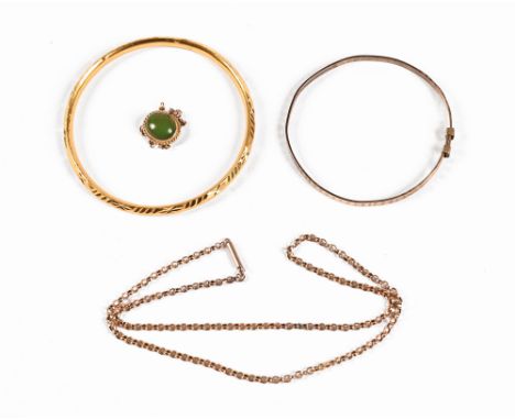 A gold coloured metal bangle, 12.61 grams, together with a rolled gold bangle and a 9 ct gold buckle with green stone and a c