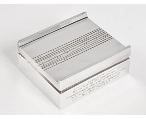 A silver cigarette box, engraved 1944-1977 presented by the Governors of Loughborough College of Art & Design to Edward Sharp