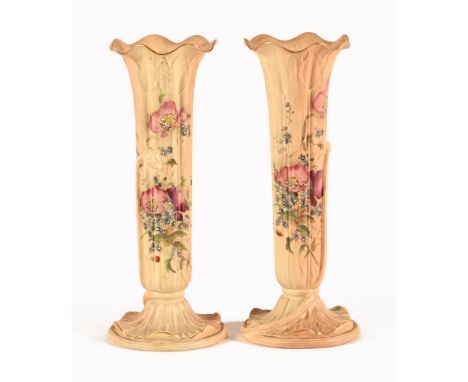 A pair of Royal Worcester slender vases, with flared lip and hand painted with floral sprays with green printed mark beneath 