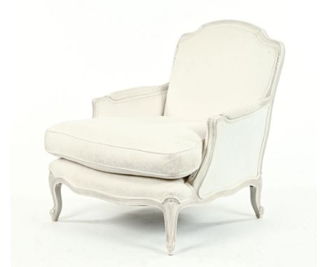 A 20th century period style armchair, in the Louis XV style, with cream upholstery and cabriole legs.  Height 90 cm, width at