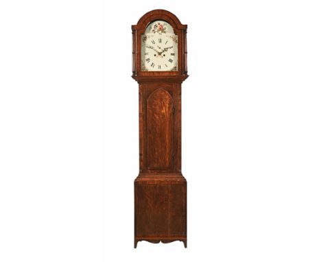 An early 19th century mahogany longcase clock, with two train striking movement with arched hood and arched door, the case ra