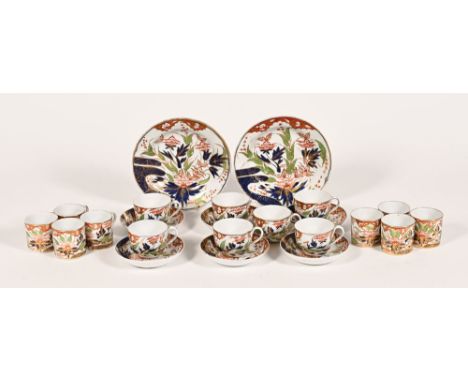 A part tea set in the manner of Derby, decorated in floral and gilt design, comprising two large dishes diameter 21.5 cm, six