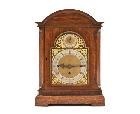 An early 20th century oak cased bracket clock, with three train fusee movement, the chapter ring inscribed Pearce and Sons Hu