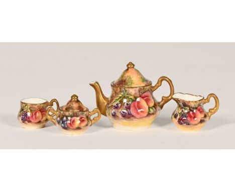 A Royal Worcester miniature four piece tea service, decorated with fruit.  Height +/- 7.5 cm.   CONDITION REPORT:  All four p