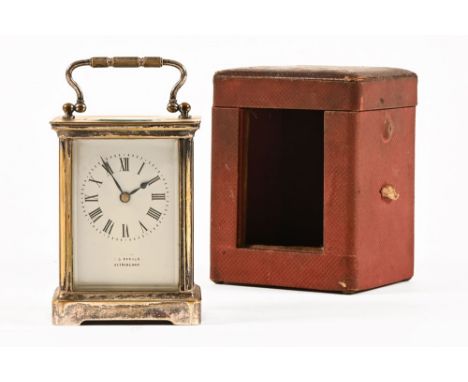 An Edwardian carriage clock, the dial marked E.J. Parker Altrincham, with silver plated case (worn), with key.  Height exclud