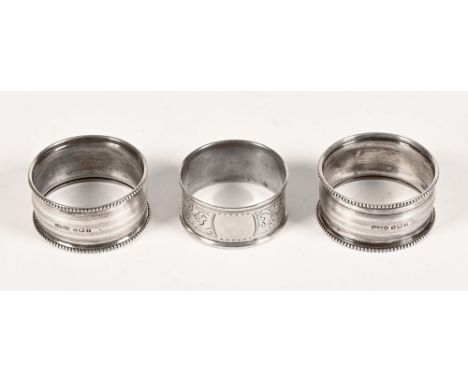 A pair of silver napkin rings, with gadrooned rims and engine turned lines, Birmingham 1918 manufacturer GFWS 16.3 grams, tog