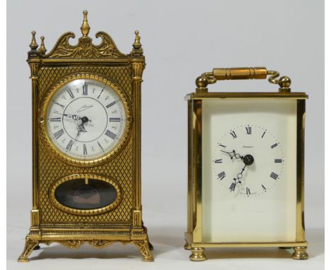 A brass 8 day carriage clock, white dial with Roman numerals, signed Dominion, movement marked I Feld, together with another 